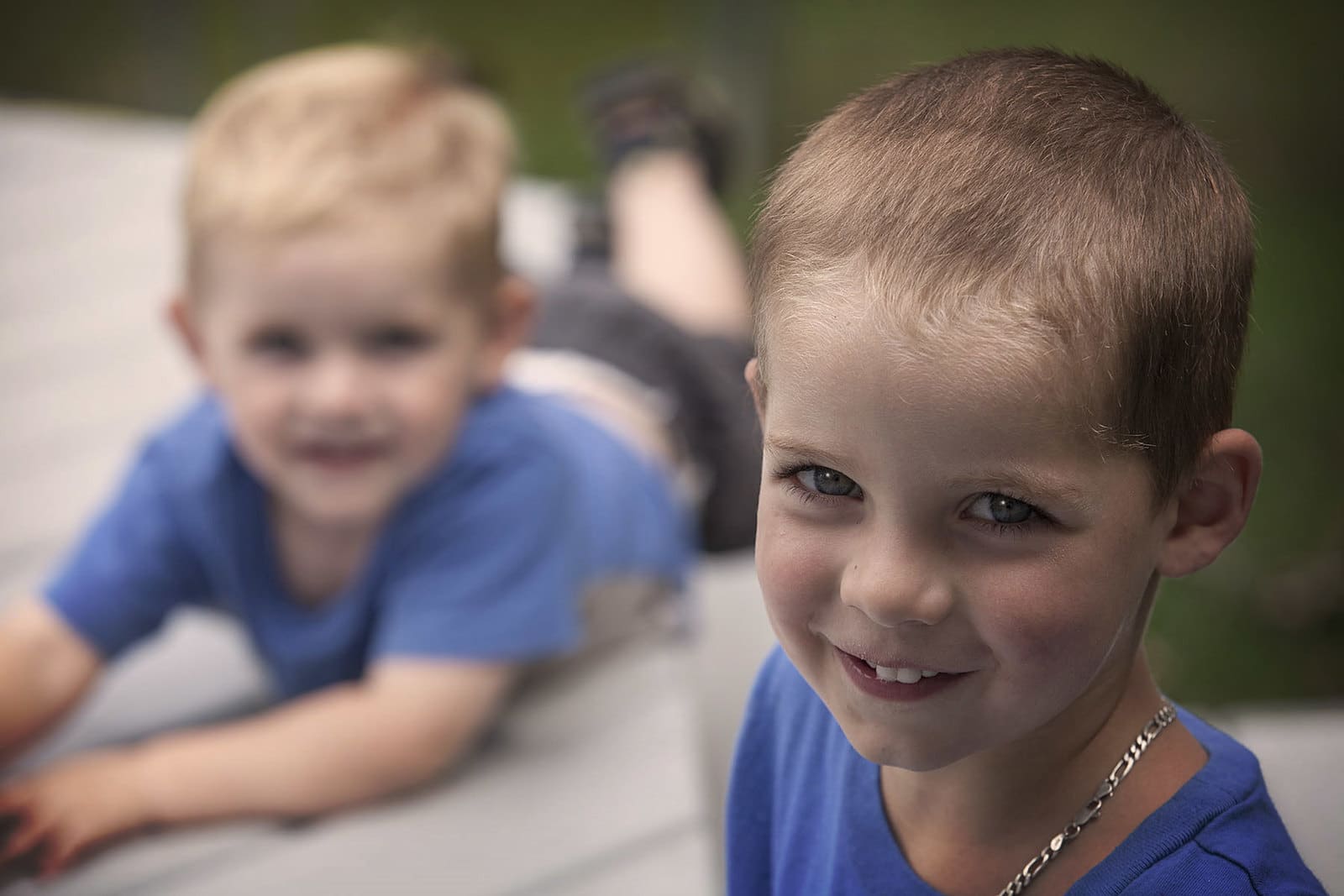 2 smiling blond brothers