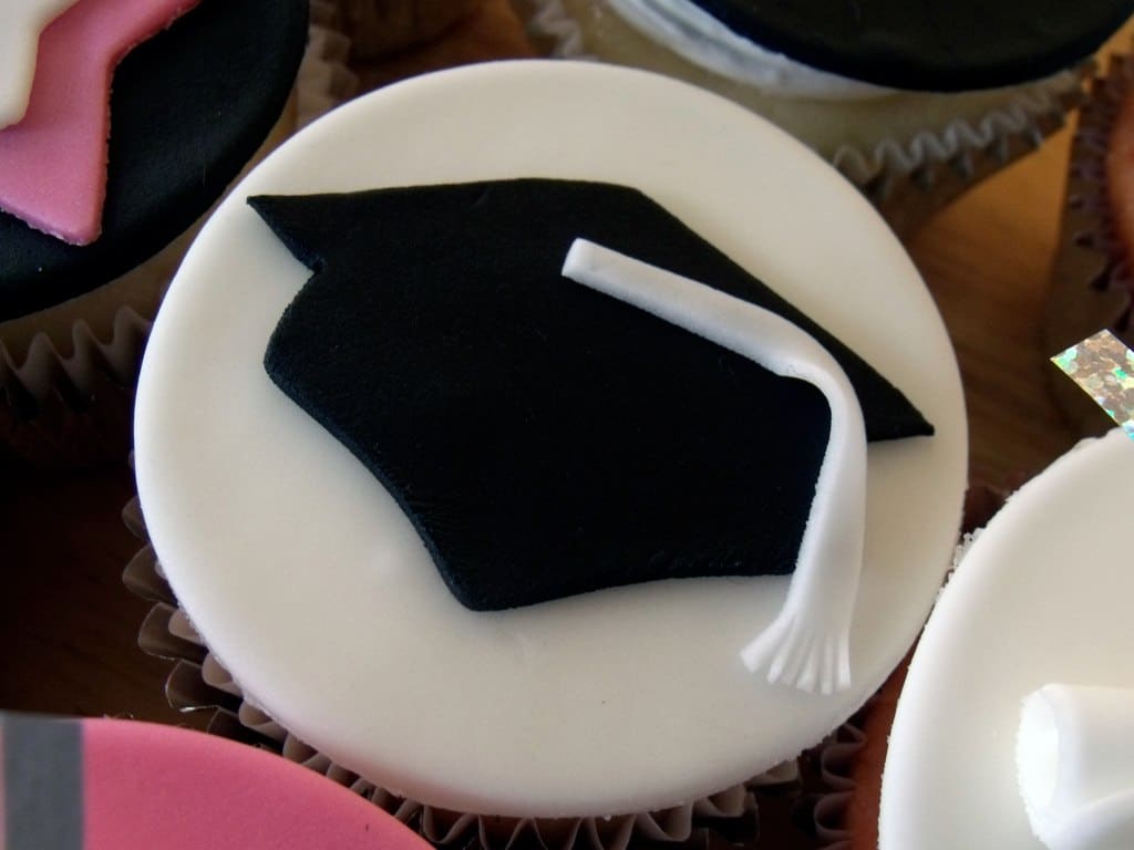 black graduation cap w white tassel on cupcake