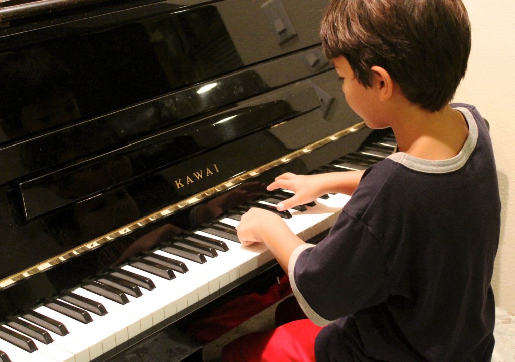 Boy playing piano