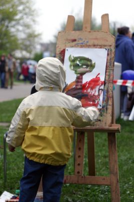 artist painter boy standing at easel