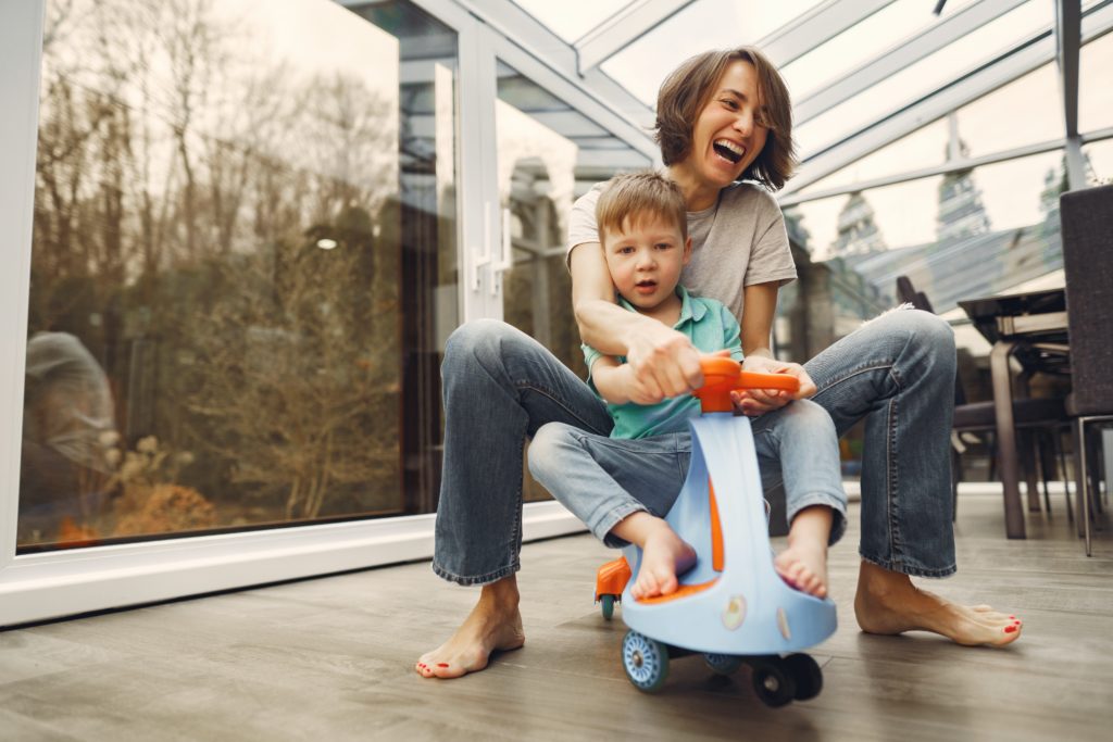 mother &amp; son riding a twist car